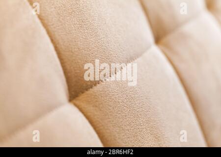 beige suede fabric. Close-up of a faux suede or nubuck fabric. Sewing  accessories and fabrics. Short pile texture. Stock Photo