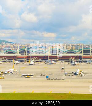 ISTANBUL, TURKEY - MAY 23, 2017: Planes at airfield of Istanbul International Airport, cityscape in backgrund, Turkey Stock Photo