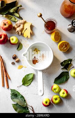 Ingredients for apple cider on a white textured background. Stock Photo