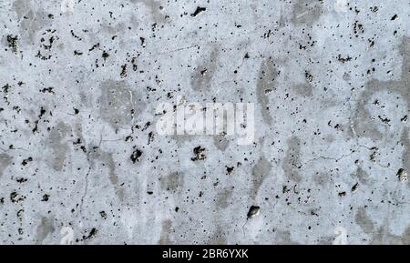 A gray concrete wall interspersed with white plaster. Background. Blur abstract blank gray cement concrete texture wall for background and wallpaper Stock Photo