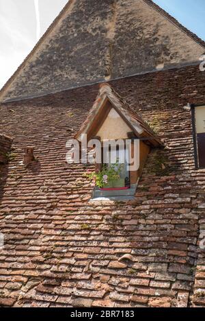 Old tiled roof of house in pilgrimage town of Rocamadour, Episcopal city and sanctuary of the Blessed Virgin Mary, Lot, Midi-Pyrenees, France Stock Photo