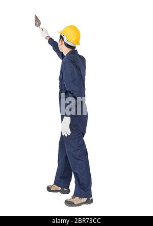 Portrait of a workman with blue coveralls and hardhat in a uniform holding steel trowel on white background with clipping path Stock Photo