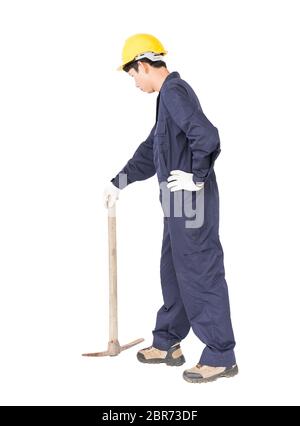 Young man in uniform hold old pick mattock that is a mining device, Cut out isolated on white background Stock Photo