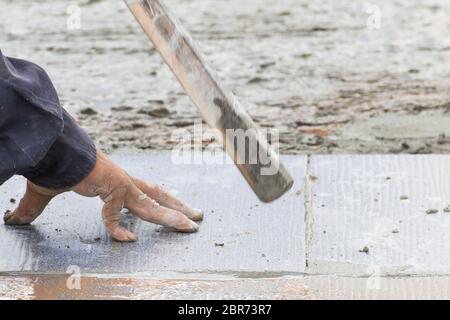 Mason was repaired for the floor tiles Stock Photo