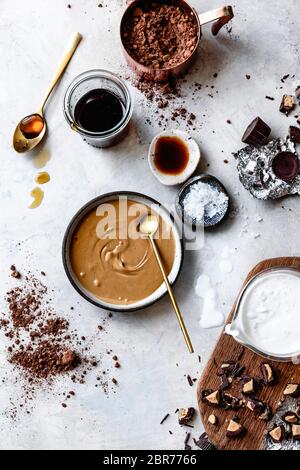 Ingredients for peanut butter cup and chocolate fudge popsicles. Stock Photo