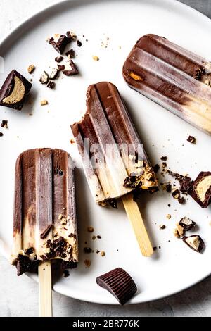 Peanut butter and chocolate fudge popsicles. Stock Photo