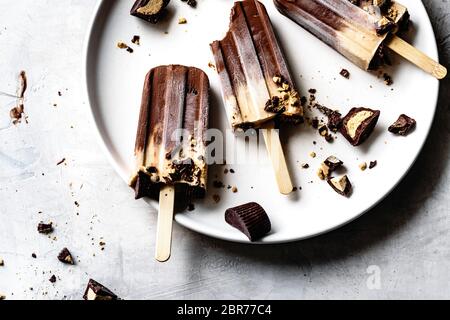 Peanut butter and chocolate fudge popsicles. Stock Photo