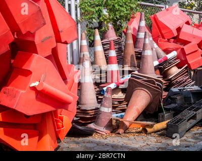 the orange traffic barrier barrels to detour traffic around construction zone shallow Stock Photo