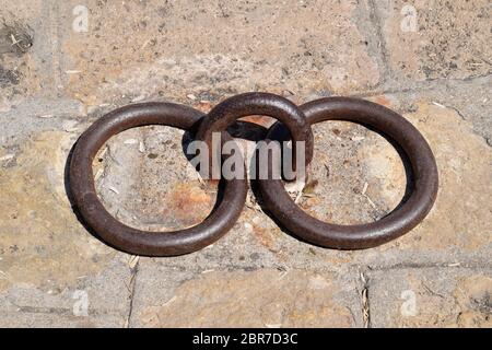 rings for mooring yachts and ships. Fixing mooring knot on the pier. Stock Photo