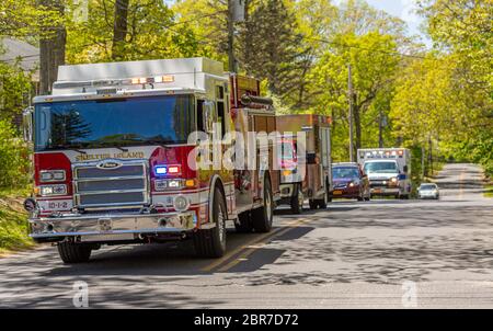 Several Shelter Island Emergency vehicles with lights on Stock Photo