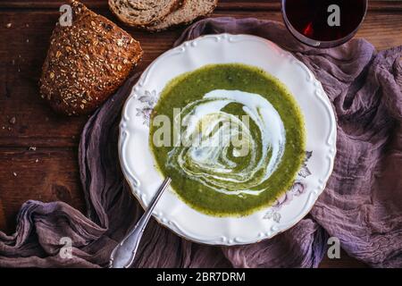 Broccoli soup with yogurt served in a vintage plate Stock Photo