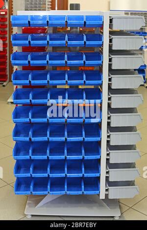 Storage Organizer Rack With Blue Plastic Sorting Bins Stock Photo