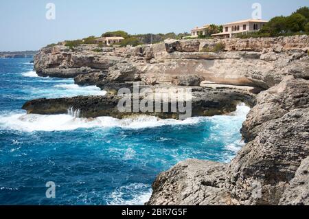 Small Lighthouse on Mallorca torre porto petro, water activities Stock Photo