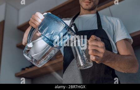 colleagues discussing current tasks standing in the office Stock Photo