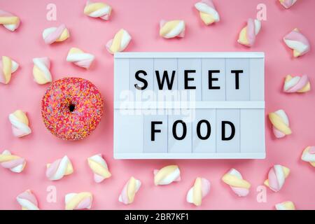 Delicious Donut with Lightbox on pink Background Stock Photo