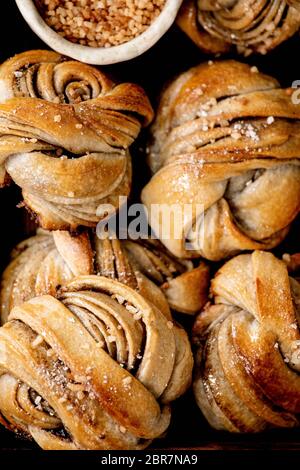 Close up of traditional Swedish cardamom sweet buns Kanelbulle. Flat lay, food background Stock Photo