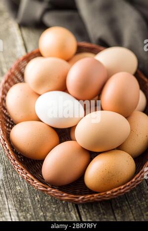 Raw chicken eggs in basket. Stock Photo