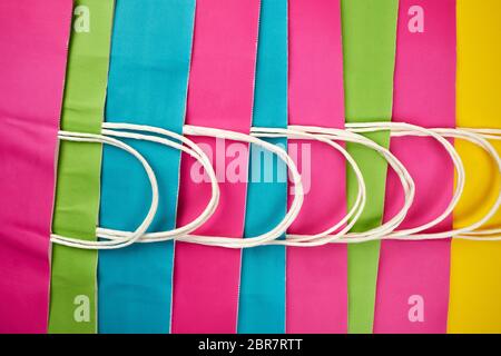multicolored paper shopping bags with handles, full frame Stock Photo