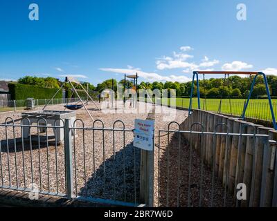 Children's playground closed due to Covid-19 Coronavirus pandemic lockdown on sunny day, Longniddry, East Lothian, Scotland, UK Stock Photo