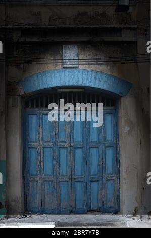 Pattern,background and texture of old accordion wooden doors painted blue color Stock Photo