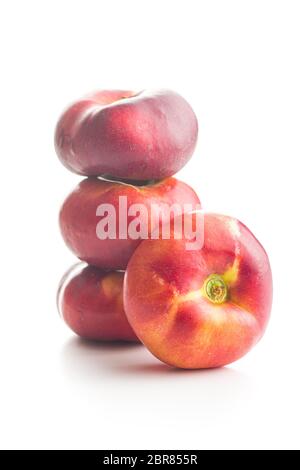 Ripe flat nectarines isolated on white background. Stock Photo