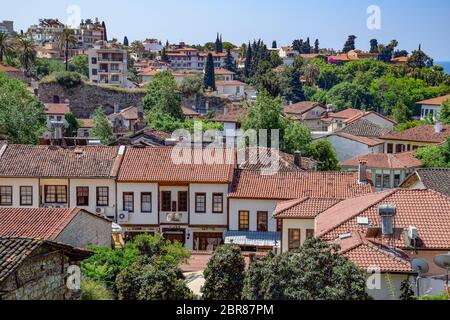 Antalya, Turkey - May 19, 2019: View from the observation deck on the roofs of the old buildings of the old city of Kaleici in Antalya, Turkey. Stock Photo