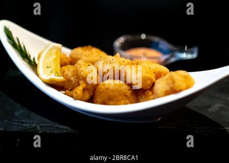 Deep fried shrimp ball with lemon and dipping sauce. Stock Photo