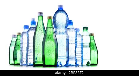 Composition with different sorts of bottles containing mineral water isolated on white Stock Photo