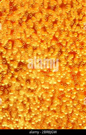 Highly detailed texture of gaseous liquid with sparkling yellow bubbles Stock Photo