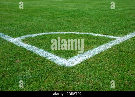 White corner lines on empty soccer grass field Stock Photo