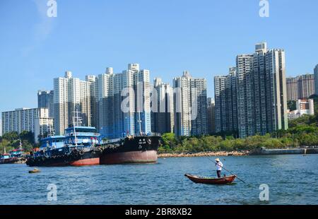 A fisherman fishing in the Aberdeen harbour in Hong Kong. Stock Photo