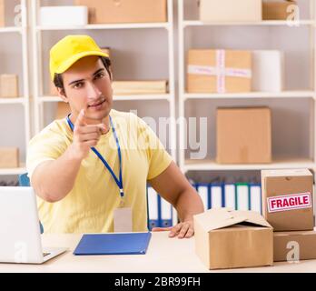 The handsome contractor working in box delivery relocation service Stock Photo