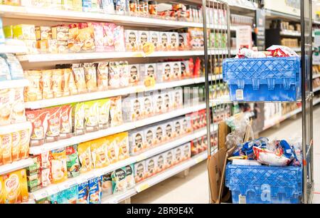 BANGKOK / THAILAND: MAY 15 - 2020: The goods of food and beverage at the supermarket shelf aisle prepare to shopper buy to hoarding. Stock Photo