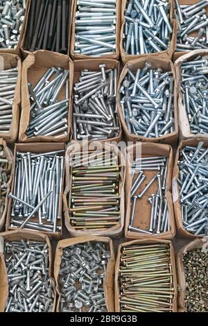 Various Bolts and Screws in Boxes Stock Photo