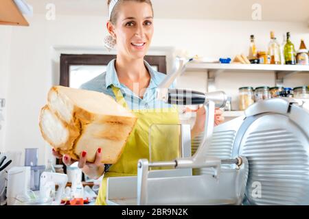 Sliced Bread in Cutting Machine / Industrial Bread Slicer in Supermarket  with Bread Crumbs. Ready to Use Stock Photo - Alamy