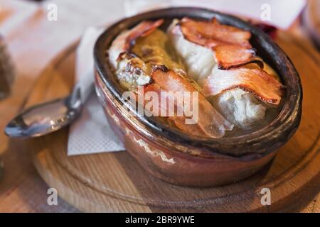 Stuffed Cabbage Rolls in a bowl, covered with bacon rashers, tradiotional Macedonian cuisine Stock Photo