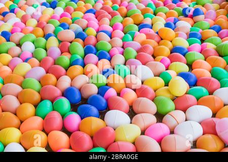 The Colorful easter eggs,Colorful plastic eggs toys floating on the water background Stock Photo