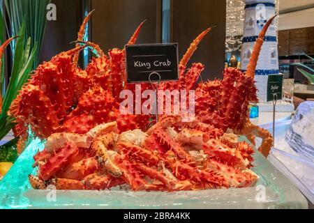 Alaskan King crab in seafood on ice buffet bar Stock Photo