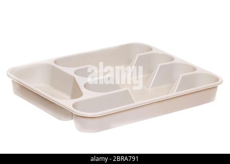 Empty plastic box background. Closeup of a beige plastic container for cutlery isolated on a white background. Macro. Stock Photo