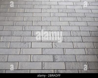 tiled terrazzo floor with brown ceramic tiles useful as a background Stock Photo
