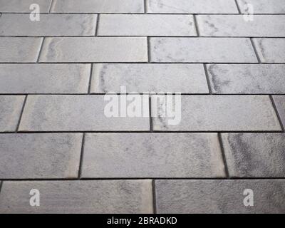 tiled terrazzo floor with brown ceramic tiles useful as a background Stock Photo