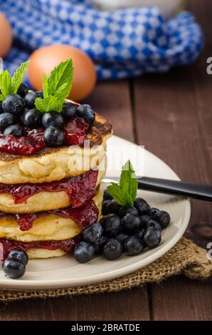 Glutten-free pancakes with jam and blueberries, bio healthy ingredients, fresh mint on top Stock Photo