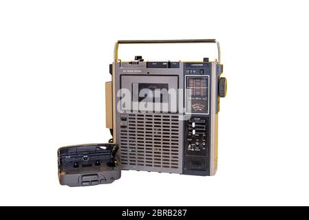Isolated on white background dirty old 1970s style cassette player radio and portable cassette player. Stock Photo