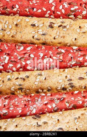 Beetroot and rye flour crackers with vegetables for making snacks background texture. Vegetarianism and healthy eating. Stock Photo