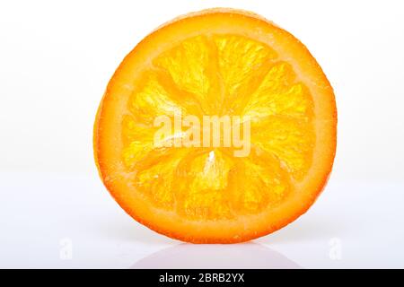 Slices Dried oranges or tangerines isolated on a white background. Vegetarianism and healthy eating. Stock Photo