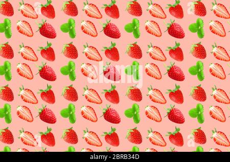Fruit pattern. Colorful of fresh strawberries texture slices on coral pastel background. From top view. Stock Photo