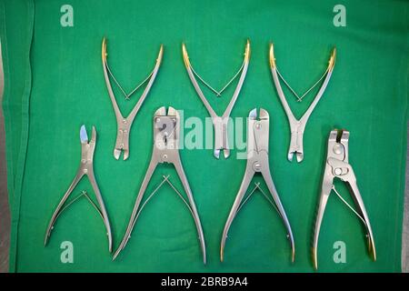 different surgical side cutters lie side by side on one surgical drape Stock Photo