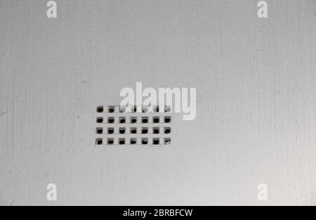 An air brick isolated in a white cement plastered wall indoor in a private house image with copy space Stock Photo