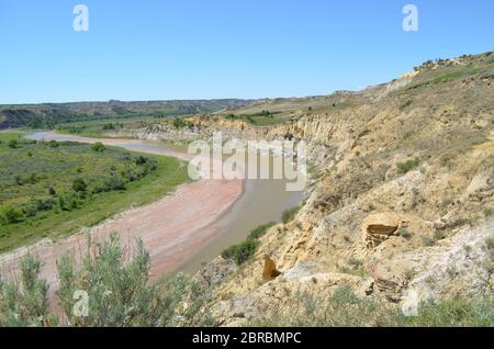 Spring in the North Dakota Badlands: Looking Downstream Toward Jules Creek on the Little Missouri River in Theodore Roosevelt National Park South Unit Stock Photo