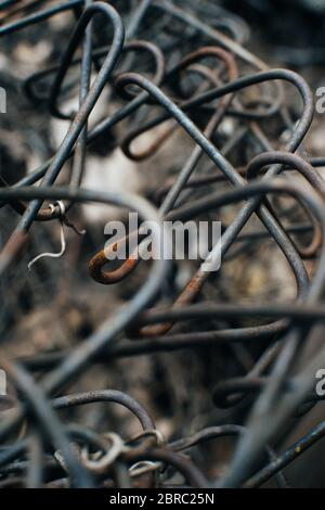 Rusty iron wire. Old mesh netting. Pieces of wire. Scrap metal. Close-up. Macro Stock Photo